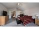 Spacious main bedroom features neutral walls, carpet, and access to an adjoining room at 12493 Loudoun Pl, Fishers, IN 46037