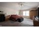 Spacious main bedroom features neutral walls, carpet, and a large window allowing natural light to fill the space at 12493 Loudoun Pl, Fishers, IN 46037
