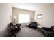 Sitting room with neutral carpet, a window, comfortable chairs, and side tables at 12493 Loudoun Pl, Fishers, IN 46037