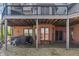 Backyard offers a relaxing spot with a hot tub, string lights, brickwork and shade from the deck above at 12608 E 86Th St, Indianapolis, IN 46236