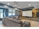 Finished basement features a large screen, stone accent wall, and comfortable seating, perfect for home theatre experience at 12608 E 86Th St, Indianapolis, IN 46236