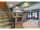 Finished basement area showcasing a wet bar, staircase, and dining area, perfect for entertaining and relaxation at 12608 E 86Th St, Indianapolis, IN 46236
