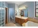 Bathroom with tiled floor features double vanity, soaking tub, and a separate water closet at 12608 E 86Th St, Indianapolis, IN 46236