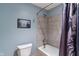 Cozy bathroom featuring a toilet and bathtub with tiled walls, creating a serene and functional space at 12608 E 86Th St, Indianapolis, IN 46236