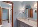 Elegant bathroom with marble countertops, gray cabinetry, and modern lighting at 12608 E 86Th St, Indianapolis, IN 46236