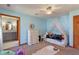 Bedroom featuring a bed with canopy, dresser, and en-suite bath at 12608 E 86Th St, Indianapolis, IN 46236