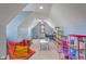 Spacious bonus room in light blue hue with vaulted ceilings, natural light, and versatile play/study area, perfect for  at 12608 E 86Th St, Indianapolis, IN 46236