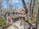Beautiful home boasts a brick facade, a well-manicured lawn, and a driveway with a basketball hoop at 12608 E 86Th St, Indianapolis, IN 46236