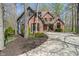Charming two-story home with brick and siding, complemented by a well-manicured front yard and winding driveway at 12608 E 86Th St, Indianapolis, IN 46236