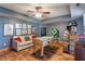 Entertaining game room featuring a foosball table, cozy seating, and shelves filled with games at 12608 E 86Th St, Indianapolis, IN 46236