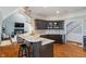 Well-appointed kitchen with granite countertops, stainless steel appliances and dark wood cabinets at 12608 E 86Th St, Indianapolis, IN 46236