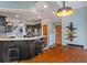 Open-concept kitchen features dark cabinetry, stainless steel appliances, and a breakfast bar at 12608 E 86Th St, Indianapolis, IN 46236
