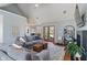 Inviting living room features a high ceiling, neutral walls, comfortable seating, and stylish decor at 12608 E 86Th St, Indianapolis, IN 46236