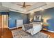 Cozy main bedroom with a ceiling fan, a light-colored rug, and ample natural light at 12608 E 86Th St, Indianapolis, IN 46236