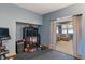 Home gym setup with bike, weights, and TV, accessible to living area, creating a convenient fitness space at 12608 E 86Th St, Indianapolis, IN 46236