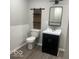 Chic bathroom featuring a modern vanity, sliding barn door shelving, and subway tile wainscoting at 1301 Stafford Rd, Plainfield, IN 46168
