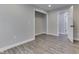 Bedroom with vinyl plank flooring, walk in closet, and neutral paint at 1301 Stafford Rd, Plainfield, IN 46168