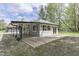 The house has a covered patio that extends to a wooden deck, perfect for outdoor living at 1301 Stafford Rd, Plainfield, IN 46168
