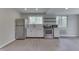 Modern kitchen featuring stainless steel appliances, ample counter space, and plenty of natural light at 1301 Stafford Rd, Plainfield, IN 46168