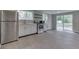 Modern kitchen features stainless steel appliances, light gray cabinets, and light gray flooring at 1301 Stafford Rd, Plainfield, IN 46168