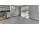 Modern kitchen with stainless steel appliances, white cabinets, and a bright atmosphere due to natural light at 1301 Stafford Rd, Plainfield, IN 46168