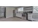 A modern kitchen equipped with stainless steel appliances, bright cabinets, and sleek design at 1301 Stafford Rd, Plainfield, IN 46168