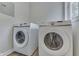 Laundry room with Samsung front load washer and dryer at 1301 Stafford Rd, Plainfield, IN 46168