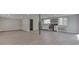 The open-concept space includes a stylish kitchen, seamlessly integrated with modern appliances and hardwood floors at 1301 Stafford Rd, Plainfield, IN 46168
