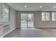 Bright living space with hardwood floors and sliding glass doors, connecting seamlessly to the outdoors at 1301 Stafford Rd, Plainfield, IN 46168