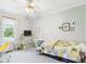 Cozy bedroom with natural light, neutral color scheme, and practical storage solutions at 1408 W Jackson St, Muncie, IN 47303