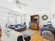 Spacious living area with hardwood floors, neutral colors, and ample natural light at 1408 W Jackson St, Muncie, IN 47303