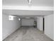 Unfinished basement with concrete floors and white painted walls providing a blank canvas for customization at 1417 E Michigan St, Indianapolis, IN 46201