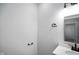 Powder room with sleek fixtures, modern vanity, and a neutral color palette at 1417 E Michigan St, Indianapolis, IN 46201