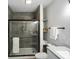 Beautiful bathroom features a tiled shower with a black-trimmed glass door at 1417 E Michigan St, Indianapolis, IN 46201