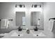 Bright bathroom features double sinks and modern lighting at 1417 E Michigan St, Indianapolis, IN 46201