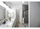 Modern bathroom with dual sinks, sleek fixtures, and a glass-enclosed shower for a spa-like experience at 1417 E Michigan St, Indianapolis, IN 46201