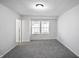 Bright bedroom features neutral walls, carpet, and a window for natural light at 1417 E Michigan St, Indianapolis, IN 46201