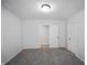 A bedroom showcasing the open doorway, neutral carpet, and walls at 1417 E Michigan St, Indianapolis, IN 46201