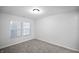 Empty bedroom with plush carpet and natural light at 1417 E Michigan St, Indianapolis, IN 46201