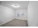 Empty bedroom with neutral carpet, ample natural light, and clean walls at 1417 E Michigan St, Indianapolis, IN 46201