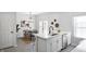 Bright, open-concept kitchen with quartz countertops, stainless steel appliances, and a dining area with stylish decor at 1417 E Michigan St, Indianapolis, IN 46201