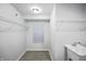The laundry room features a utility sink and wire shelving at 1417 E Michigan St, Indianapolis, IN 46201