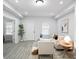 Bright and airy living room featuring modern decor, wood floors, and ample natural light at 1417 E Michigan St, Indianapolis, IN 46201