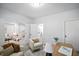 Bright office space with an open doorway showcasing a cozy living room and a glimpse of the bathroom at 1417 E Michigan St, Indianapolis, IN 46201
