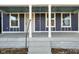 Inviting front porch with classic architectural details, perfect for welcoming guests at 1417 E Michigan St, Indianapolis, IN 46201