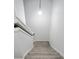 Carpeted staircase with modern lighting at 1417 E Michigan St, Indianapolis, IN 46201