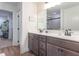 Bathroom features a double vanity, framed mirrors and a walk-in closet at 1417 Layton Rd, Anderson, IN 46011