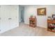 An airy room with a carpeted floor and a pair of closet doors at 1417 Layton Rd, Anderson, IN 46011