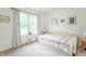 A bedroom with a bed and a window that brings natural light to the space at 1417 Layton Rd, Anderson, IN 46011