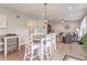 Dining room with table, six chairs, and views into living room at 1417 Layton Rd, Anderson, IN 46011